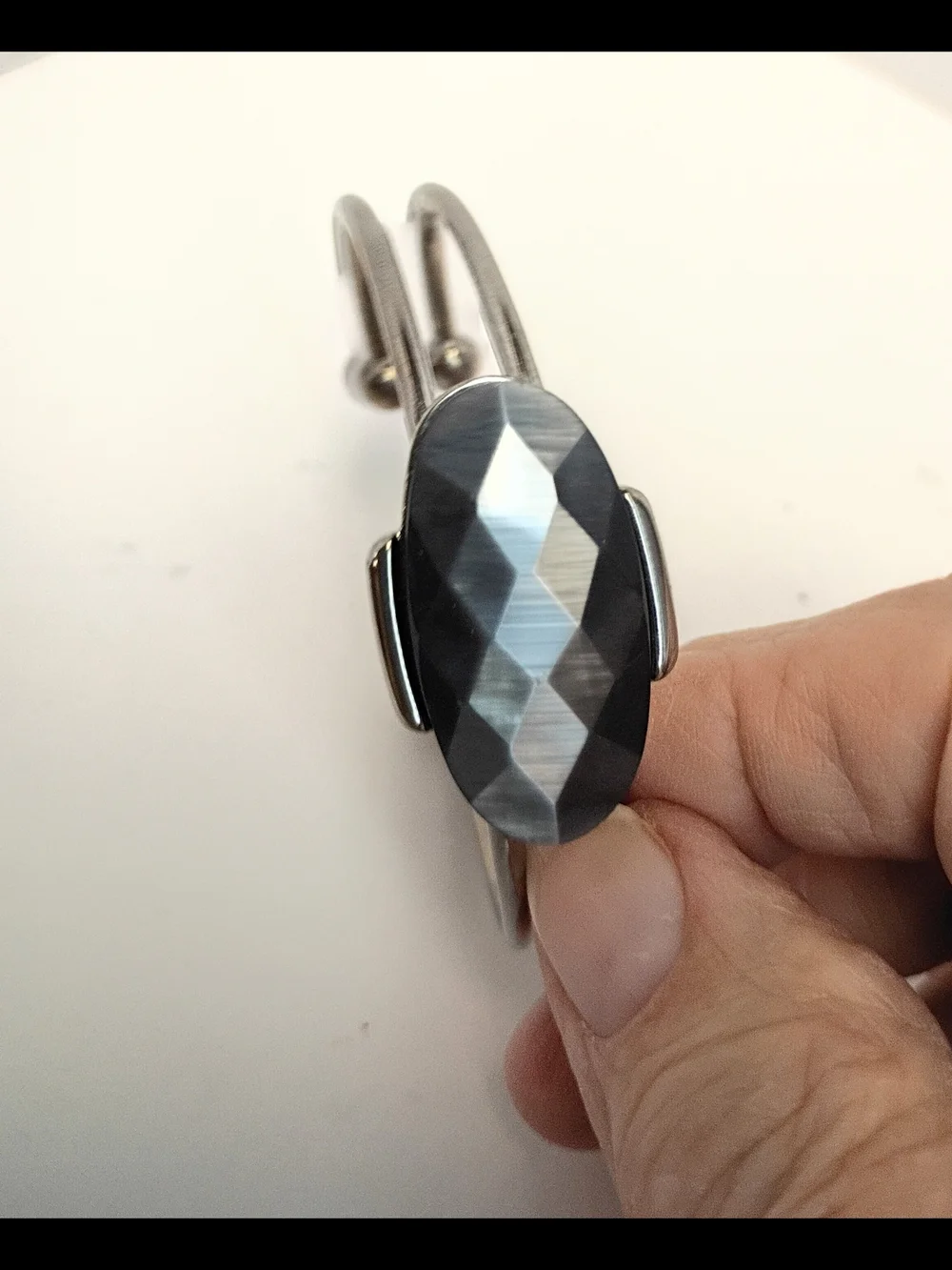 Silver-Tone Bracelet with Faceted Black Oval Center